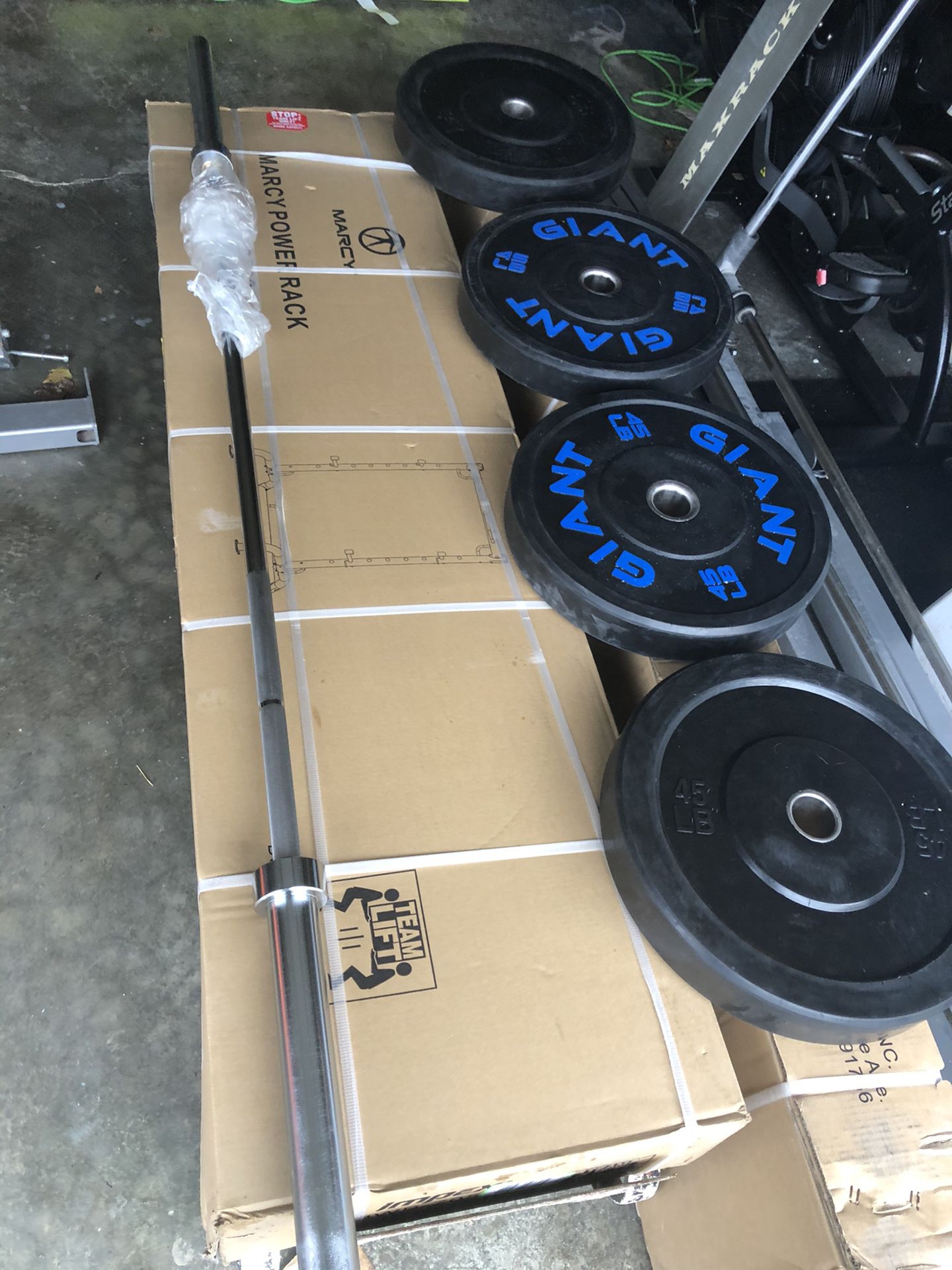 New squat rack, two pairs of bumper plates, new Barbell,