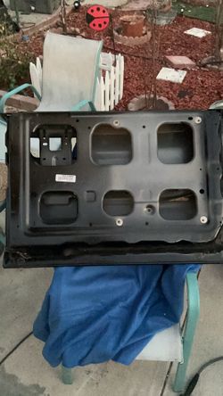 OEM black tailgate from a fifth-generation Ram 1500 Limited, most likely fitting 2019–2024 Ram 1500 DT models Black Metal Stove Cooktop Base Panel