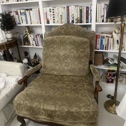Vintage traditional accent chair with carved wood arms. French/classic style