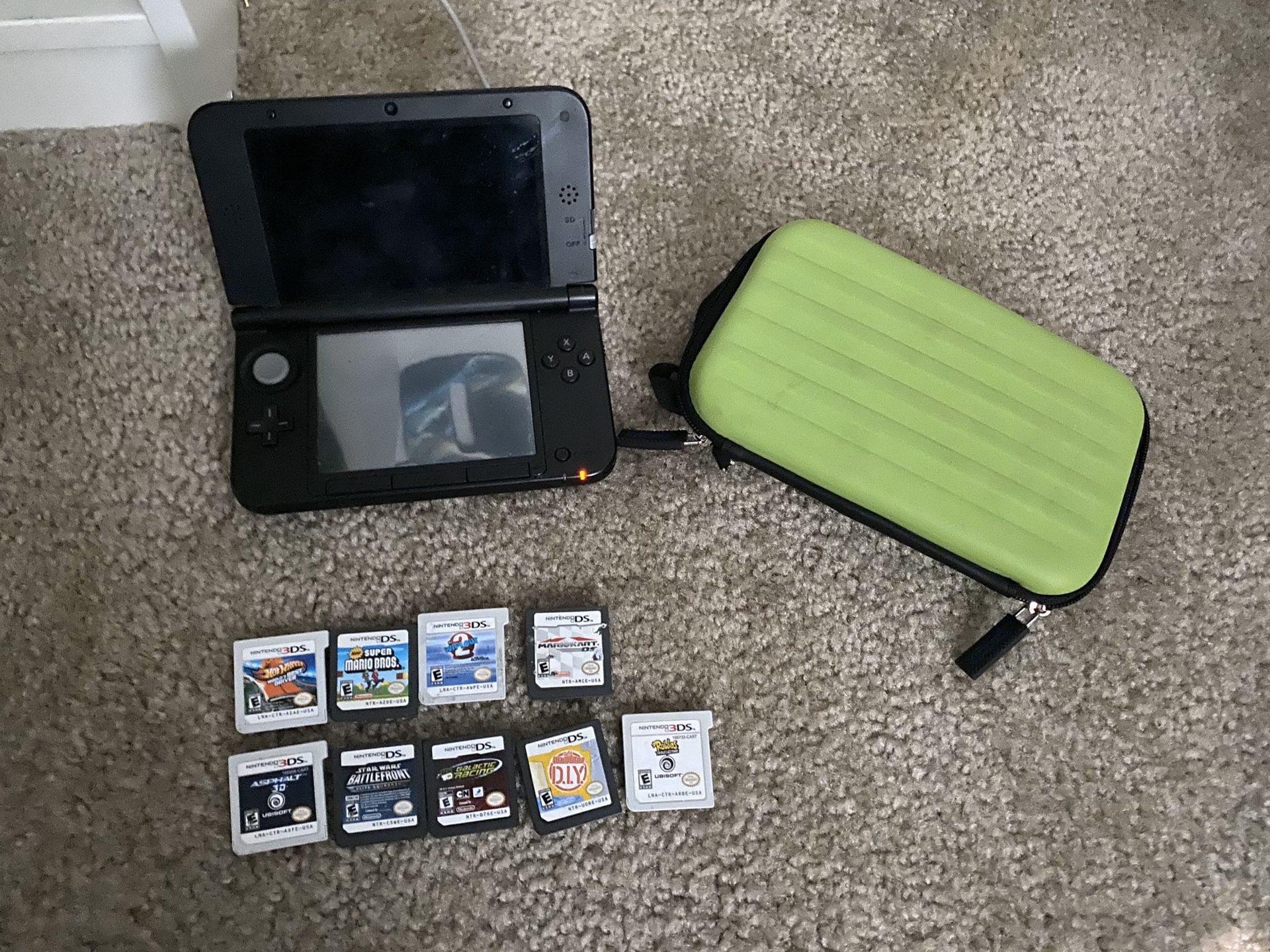 Nintendo 3DS XL with eight games
