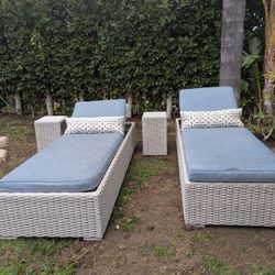 Two Outdoor Lounge Chairs And Side Tables