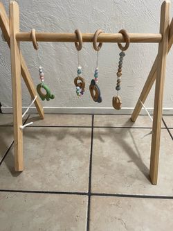 Wooden baby play gym with hanging toys