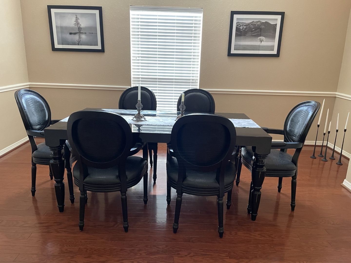 Modern baroque black lacquer dining-room table with crocodile pattern chairs