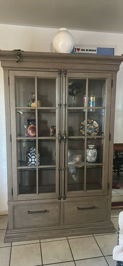 China Cabinet; beige dark ; high76”; length 47” wide 18”
