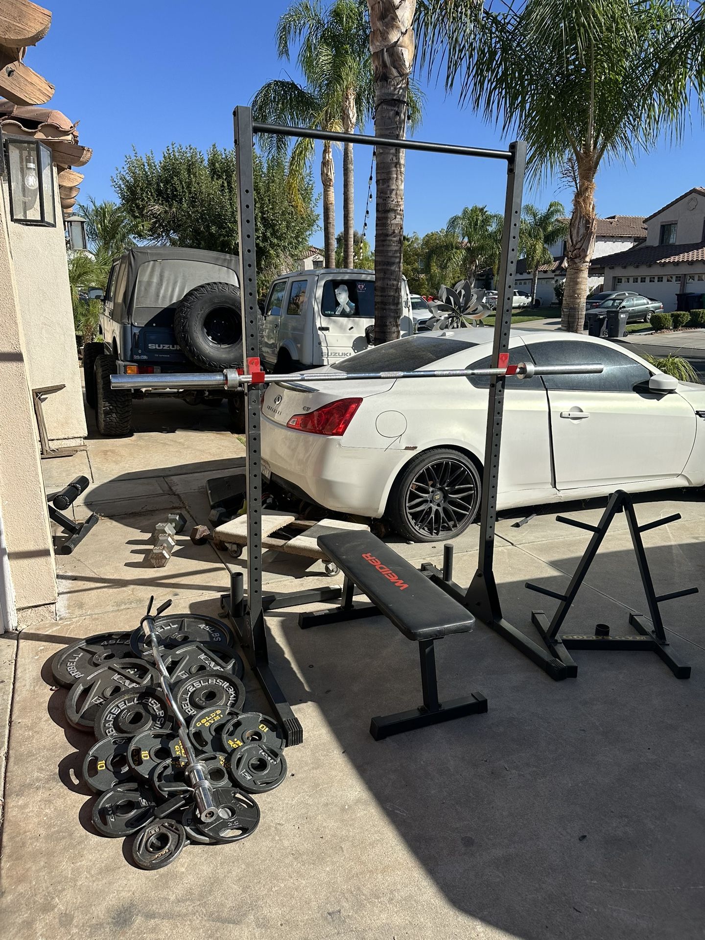 Bench press/squat rack with 7ft 45lbs bar plus 280lbs of Olympic weights and curl bar plus weights tree