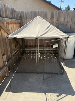 Small dog kennel   As is. Been outside