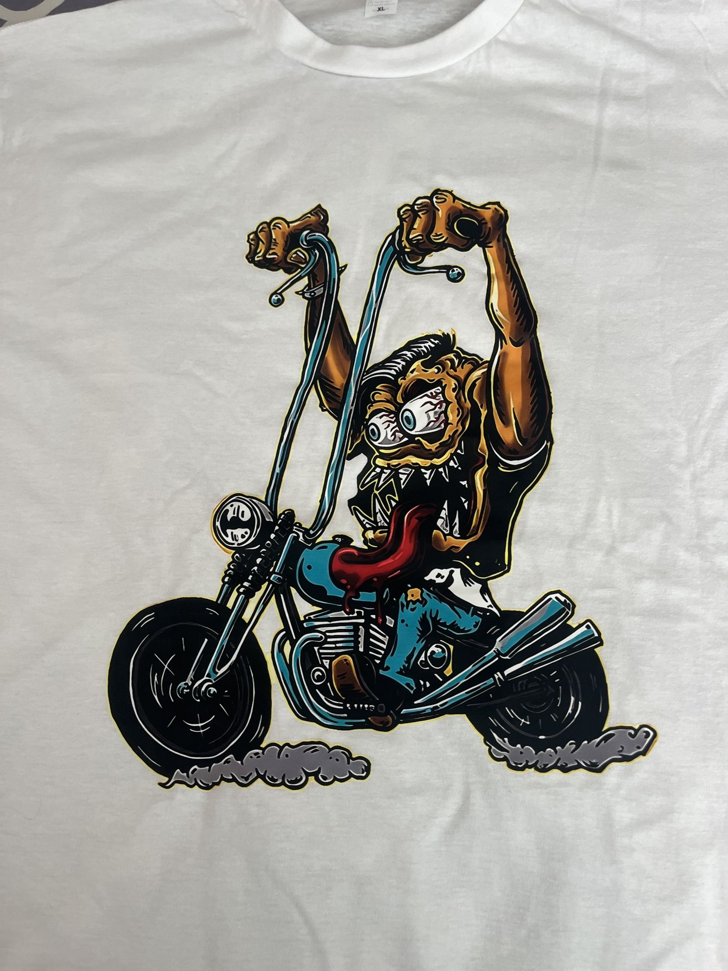 new graphic tee with a cartoon biker design, specifically a white XL T-shirt.