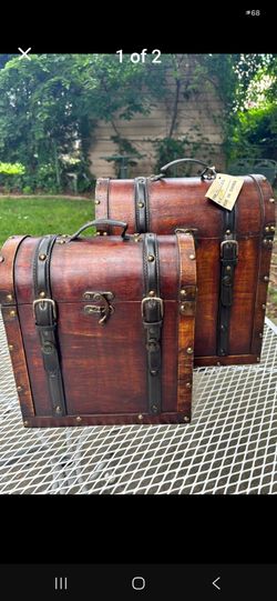 Brand New, 2 Decorated Wooden boxes, smaller one fits into the bigger one (sm 12", big 15") has a latch. Great gift boxes, firm.