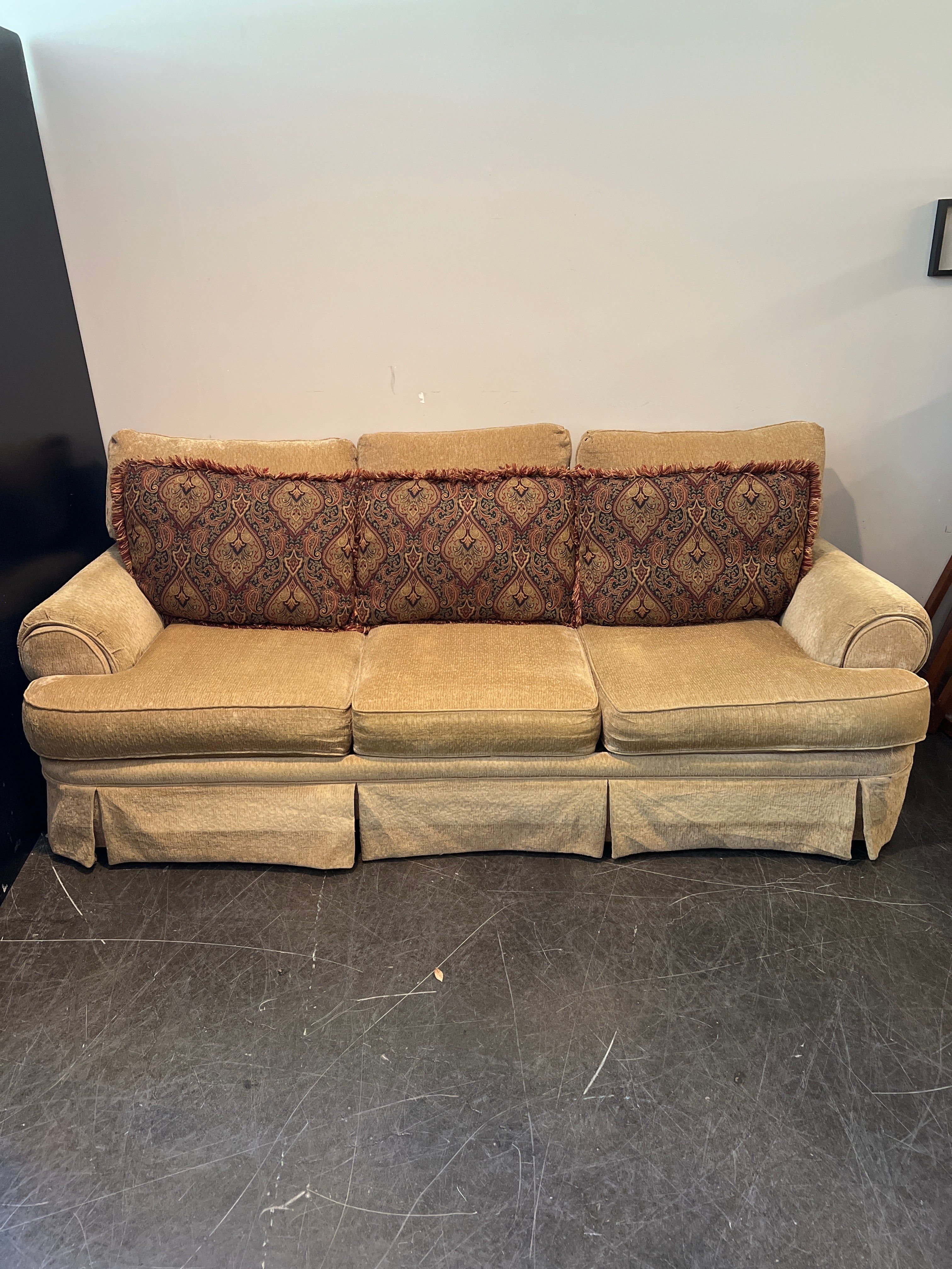 Beige Broyhill Sofa with Ornate Pillows