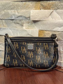 Dooney & Bourke 1975 Signature large slim wristlet in black coated canvas with tan leather trim