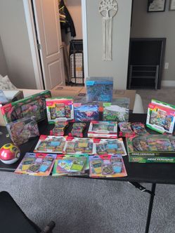 Lot of sealed Pokemon boxes ETB Trainer boxes blisters boosters pokeball tins