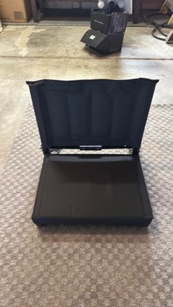 Folding stadium seat