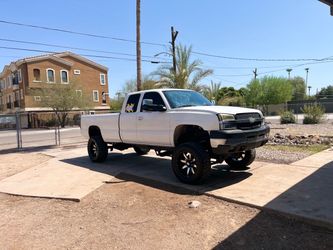 Lifted White Chevrolet Silverado Pickup Truck diesel