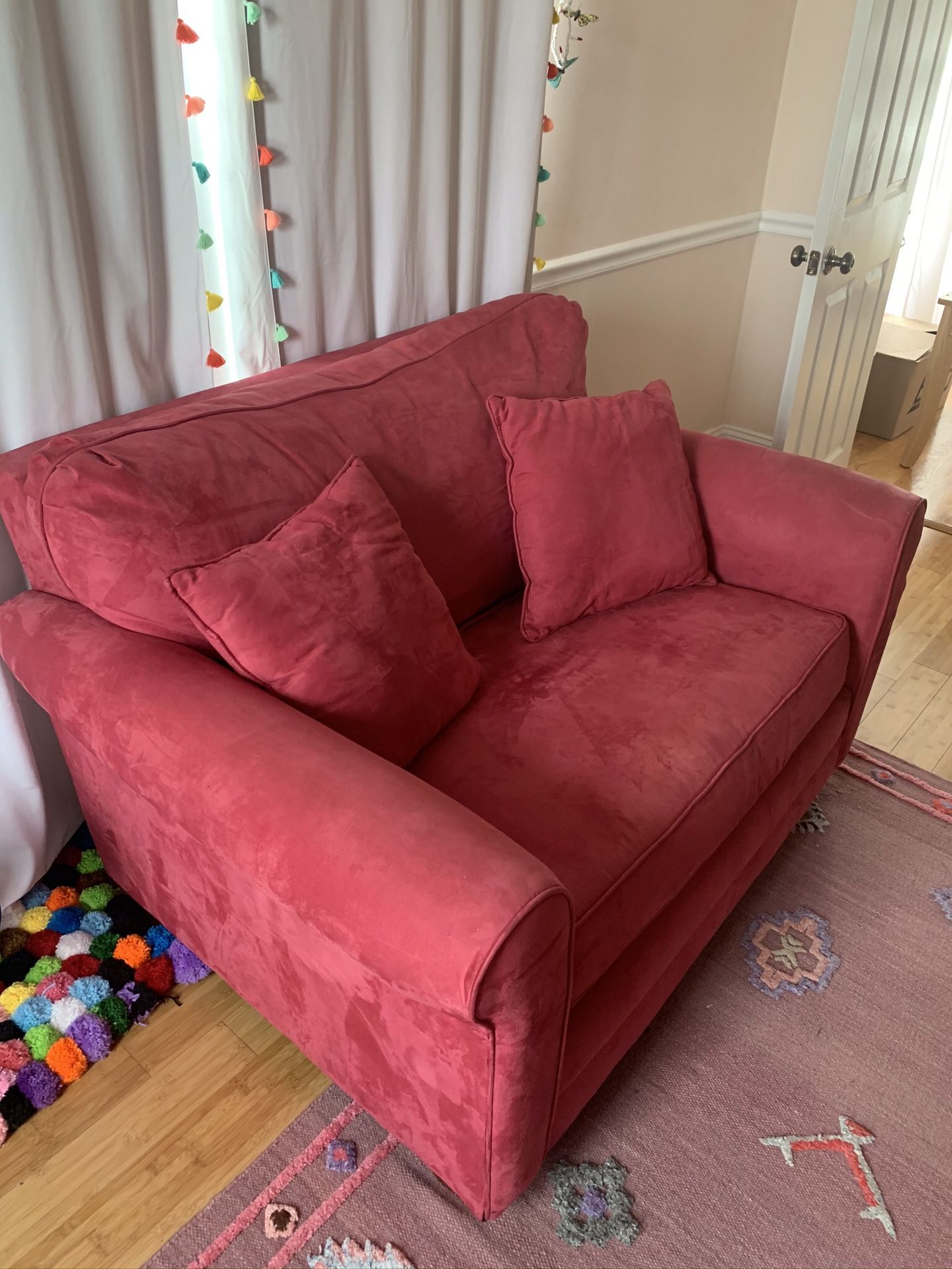 Red pull out sleeper couch 58w x 41 with matching storage ottoman 26x41 ottoman small tear in corner (pictured) can be fixed if u know how to sow