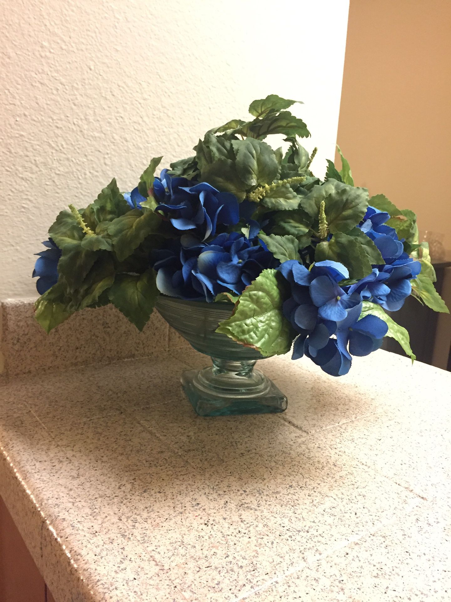Blue artificial Flowers with glass vase