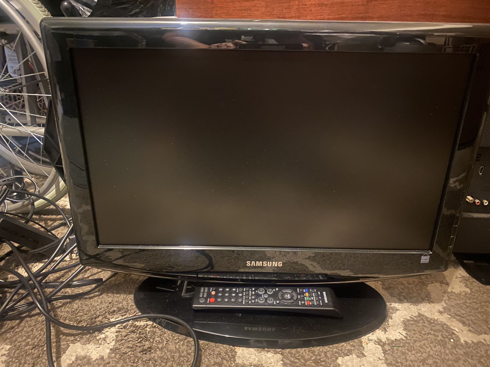 Samsung TV with remote control included.