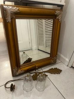 Gold Ornate Framed Mirror with Wall Sconce