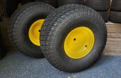 Pair of 20x10-8 Carlilse TurfTrac R/S 2 ply lawn mower tires on JD yellow wheel