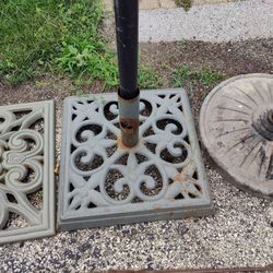 Umbrella outside stands one is $15 the other is $10 The middle one and the one to the right is left.