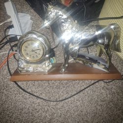 Silver Horse Snd Silver Clock On Carved Wood