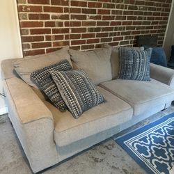 2 Gray Couches With Pillows