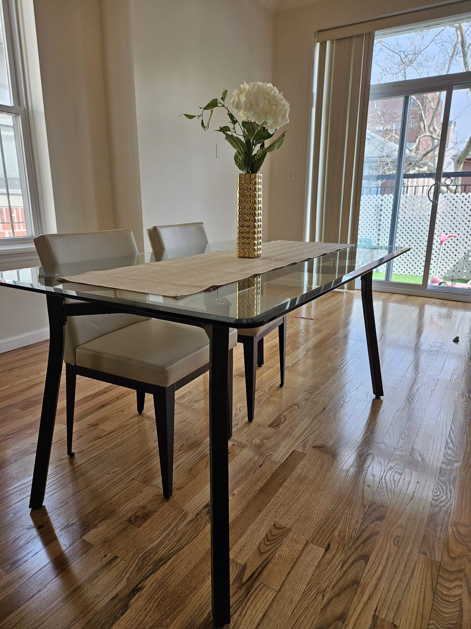 3ft x 5ft glass table with 4 leather chairs. Amisco brand  