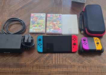 Nintendo Switch Oled  Bundle with Mario Kart 8, Mario Party Superstars, Minecraft and Extra Joy-Cons