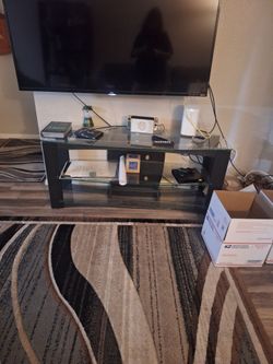 Three glass tables