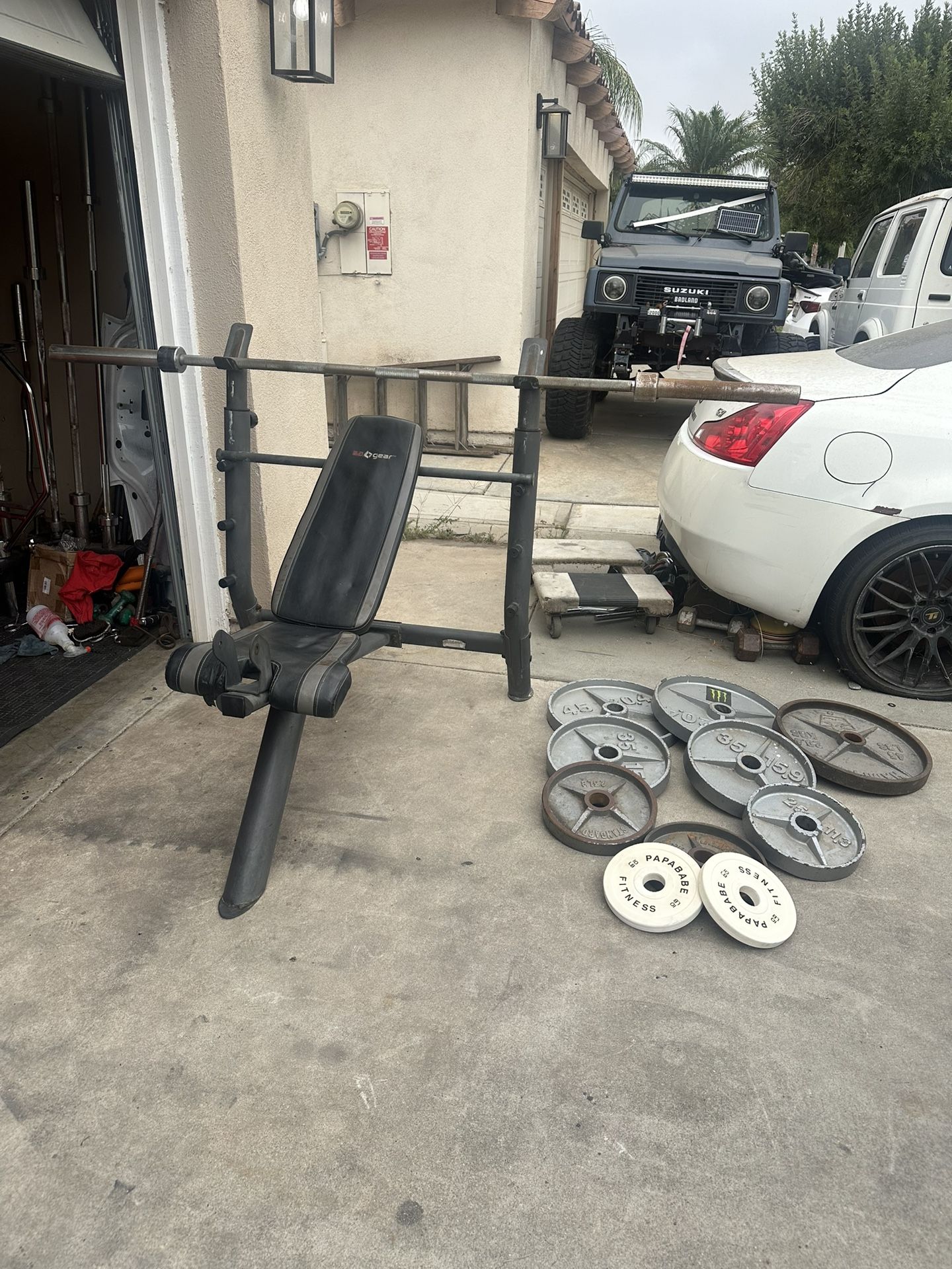 Bench press with 7ft bar plus 300lbs of Olympic weights