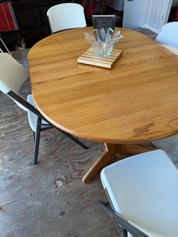 5’ by 3.5’ Round Oak Pedestal Dining Table