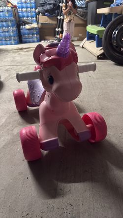 Baby girl riding unicorn