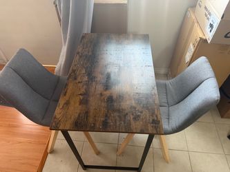 Moving Sale: 2 chairs and a table (6 months old, hardly used)