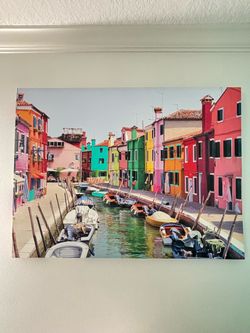 Colorful Burano, Italy canal scene with vibrant hand-painted-style buildings and boats