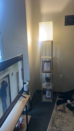 Floor length lamp with shelves
