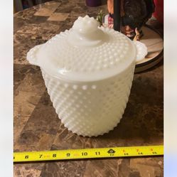 This is a vintage milk glass hobnail cookie jar with a lid, likely produced by Anchor Hocking