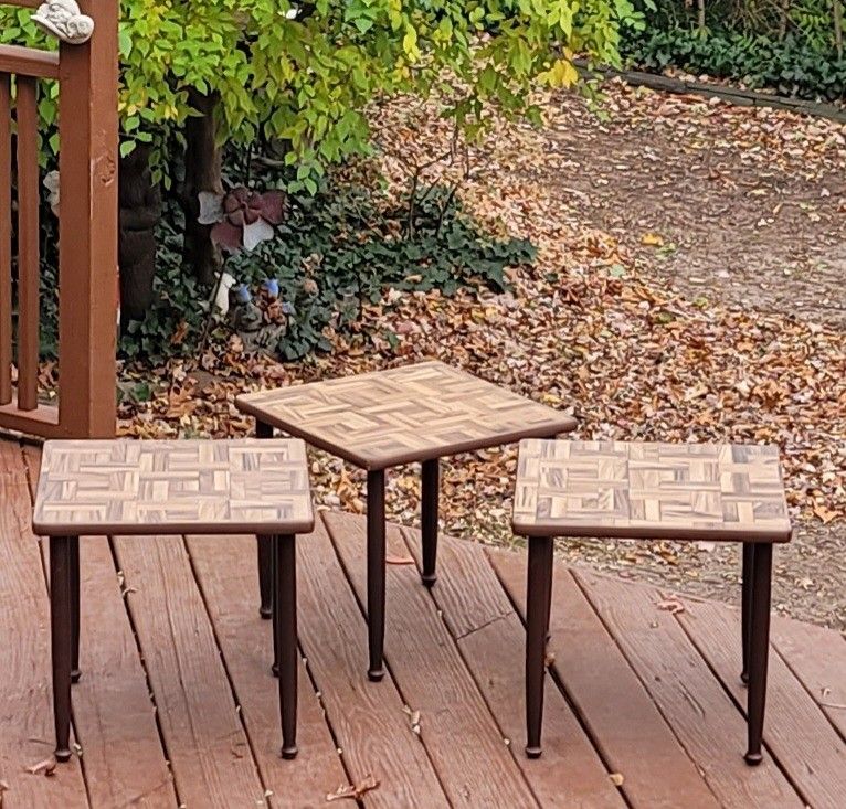 3 mid-century modern side tables with a parquet or mosaic wood-look top and tapered legs. 18" Square Top 17" High