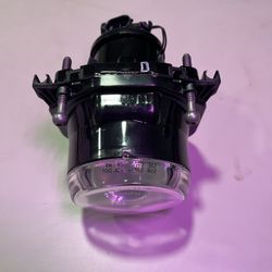 This is a Hella 90mm Bi-Halogen Headlight Module, a type of automotive lighting often used in trucks, buses, and for custom retrofitting