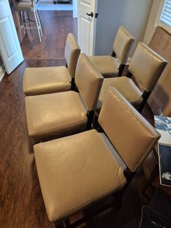 5 beige leather chairs