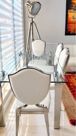 Glass Top Dining Table .                     FREE 4 Chairs cushions needs to be replaced.
