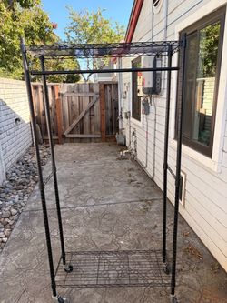 “Heavy Duty Rolling Garment Rack with Shelves – Commercial Style”.