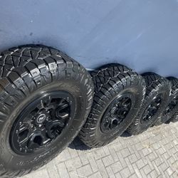 OEM BLACK FORD BRONCO RIMS AND TIRES NITTO RIDGE GRAPPLER 