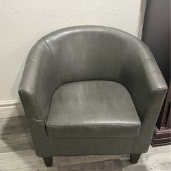 Two brown Faux leather chairs like new