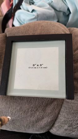 4 picture coasters in a wooden holder