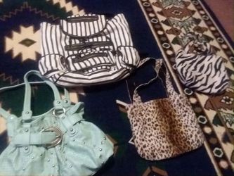 3 purses and 1 backpack 15 bucks