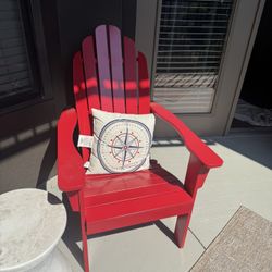 slatted red adirondack chair