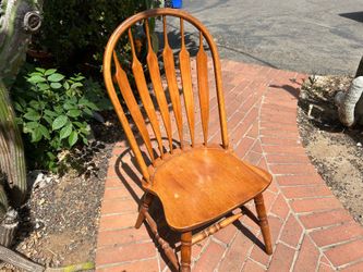 Tall back curved wooden chairs