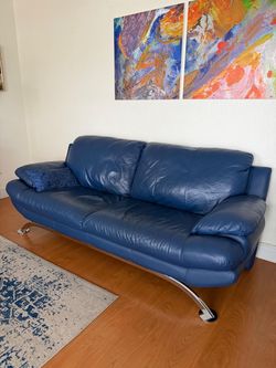 Red leather chair and Blue leather Sofa - $100