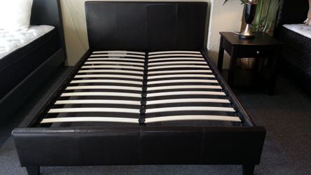Brand new black faux leather standard king or CA king platform bedframe