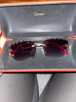 Black and red diamond cut Cartier glasses