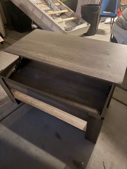 Coffee Table with riasing table top and inside storage